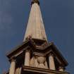 View from below of steeple showing urns