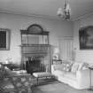 Interior view of Linhouse showing sitting room with fireplace.
