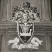 Interior.
Detail of coat of arms over W fireplace in Council Chamber.
