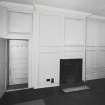 Interior.
View of panelling on W wall of NE apartment on second floor.