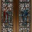 Interior.
Detail of stained glass window on N wall.