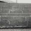 Detail of ashlar retaining wall on West side of pier ramp.