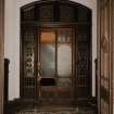 Interior. Detail of vestibule showing mosaic tile floor and leaded glass doors