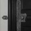 Interior. Detail of drawing room door metalwork