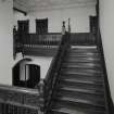 Interior. View of staircase half-landing from N