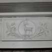 Interior. First Floor drawing room, detail of fireplace showing stag and thistle panel