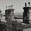 View from SSW on flat roof of E keeper's house, showing gently tapered corniced chimney stacks