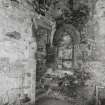 Interior, tower, second floor, main hall, South West corner, view of steps (leading to vaulted chambers) and blocked up arched window.