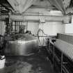 Mash House. Interior view showing (left to right) emergency douche and eye bath, mash conversion vessel (centre), and Meura 2001 mash filter (right)