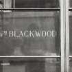 View of lettering on window screen (Wm Blackwood).