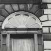 19 Walker Street.
Detail of A-type fanlight with rounded panes and decoration in corners and basal semicircle.