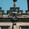 Detail of chimney, shield and carved pediment on south front