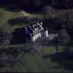 Oblique aerial view centred on the castle and tower-house, taken from the NW.