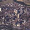 Oblique aerial view centred on the oil refinery, taken from the WNW.