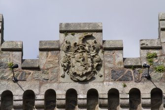 Detail of armorial panel above archway