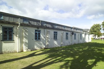 View.  Domestic site, pre-1933 barrack block hut showing clerestory roof from SSE