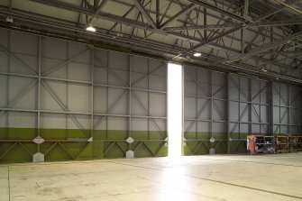 Interior. Type C aircraft hangar showing detail of sliding folding doors