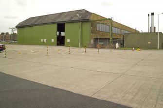 View. Type C aircraft hangar in use for vehicle repairs.