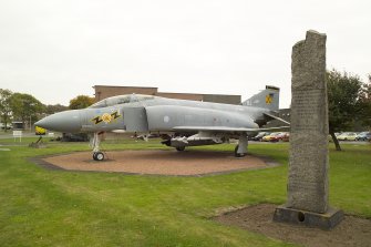 View.  Memorial to Norwegian airman who served at Leuchars Airfield during World War Two with Phantom FRG2 gate guard from W.