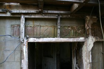 Detail of datestone above doorway in W elevation of farmhouse