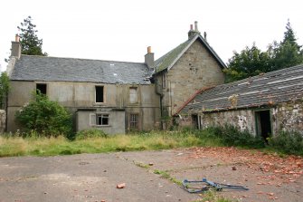 View of farmhouse and S range from W