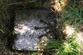 View of top of boundary marker from E