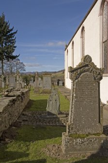 Churchyard. Pictish cross slab. Location view from SE