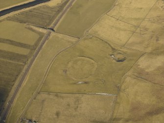 Oblique aerial view centred on the remains of the settlement, taken from the S.