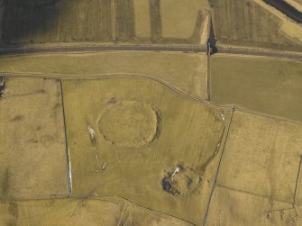 Oblique aerial view centred on the remains of the settlement, taken from the E.