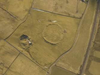 Oblique aerial view centred on the remains of the settlement, taken from the N.