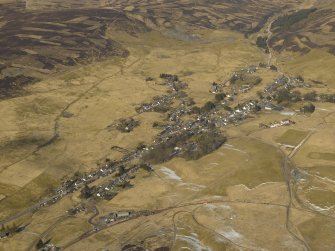 Oblique aerial view of the village and the remains of the field banks and lazy beds, taken from the SE.