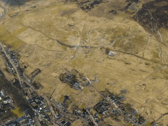 Oblique aerial view of the village and the remains of the field banks and lazy beds, taken from the E.