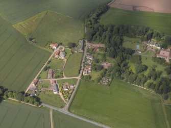 Oblique aerial view centred on the cottages with Kincaple House adjacent, taken from the SW.