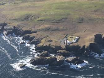 Oblique aerial view centred on the lighthouse and buildings, taken from the NE.