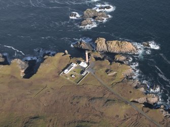 Oblique aerial view centred on the lighthouse and buildings, taken from the SSW.