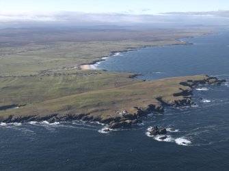 General oblique aerial view centred on the lighthouse and buildings, taken from the NW.