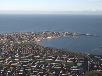 General oblique aerial view looking across Peterhead and Peterhead Bay towards the harbour and North Sea beyond, taken from the W.