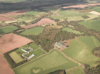 General oblique aerial view centred on the abbey with the country house and towerhouse adjacent, taken from the S.