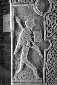Face A. detail showing figure carrying spear (B&W)