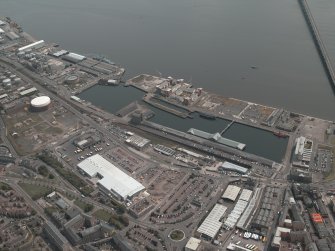 General oblique aerial view of Dundee centred on the docks, taken from the WNW.