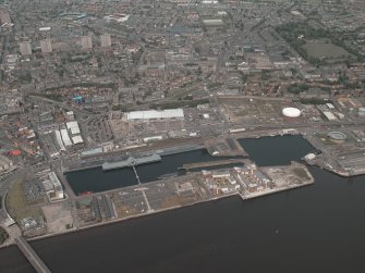General oblique aerial view of Dundee centred on the docks, taken from the SSE. Including Queen Elizabeth Wharf.