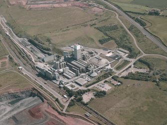 Oblique aerial view centred on the cement works, taken from the NNW.