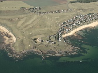 General oblique aerial view centred on the chapel and houses, taken from the S.