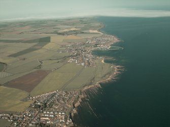 General oblique aerial view looking along the southern coastline of Fife across the villages, taken from the SW.