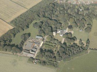 Oblique aerial view of the country house and farmsteading, taken from the WSW.