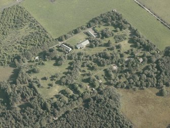 Oblique aerial view centred on the remains of the radar station, taken from the N.