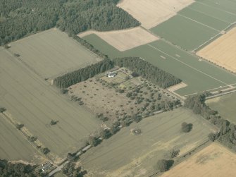 General oblique aerial view centred on the country house, taken from the SW.