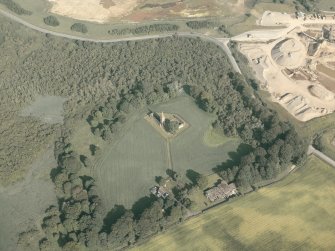 General oblique aerial view of the remains of the priory and the house, taken from the WNW.