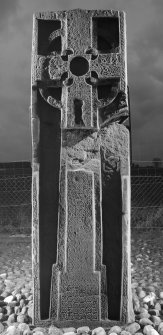 View of front face of slab with full length cross and interlace patterns (B&W), obliqely lit