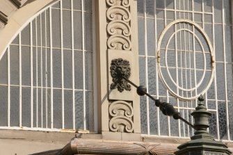 Detail of lion head and rod supporting awning